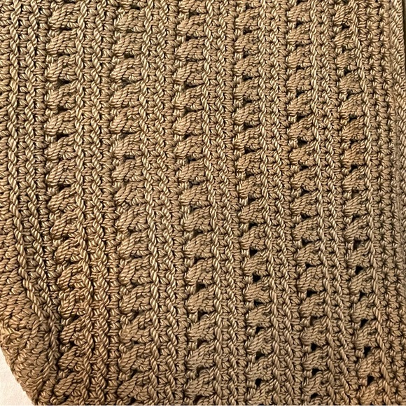 The Sak Crochet Shoulder Bag in Cognac color. Crochet Flower detail on zipper. - Picture 6 of 10